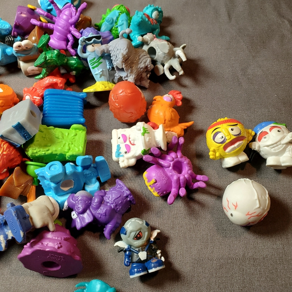 small, plastic collectible figures, Trash Pack/Zuru Smashers and others